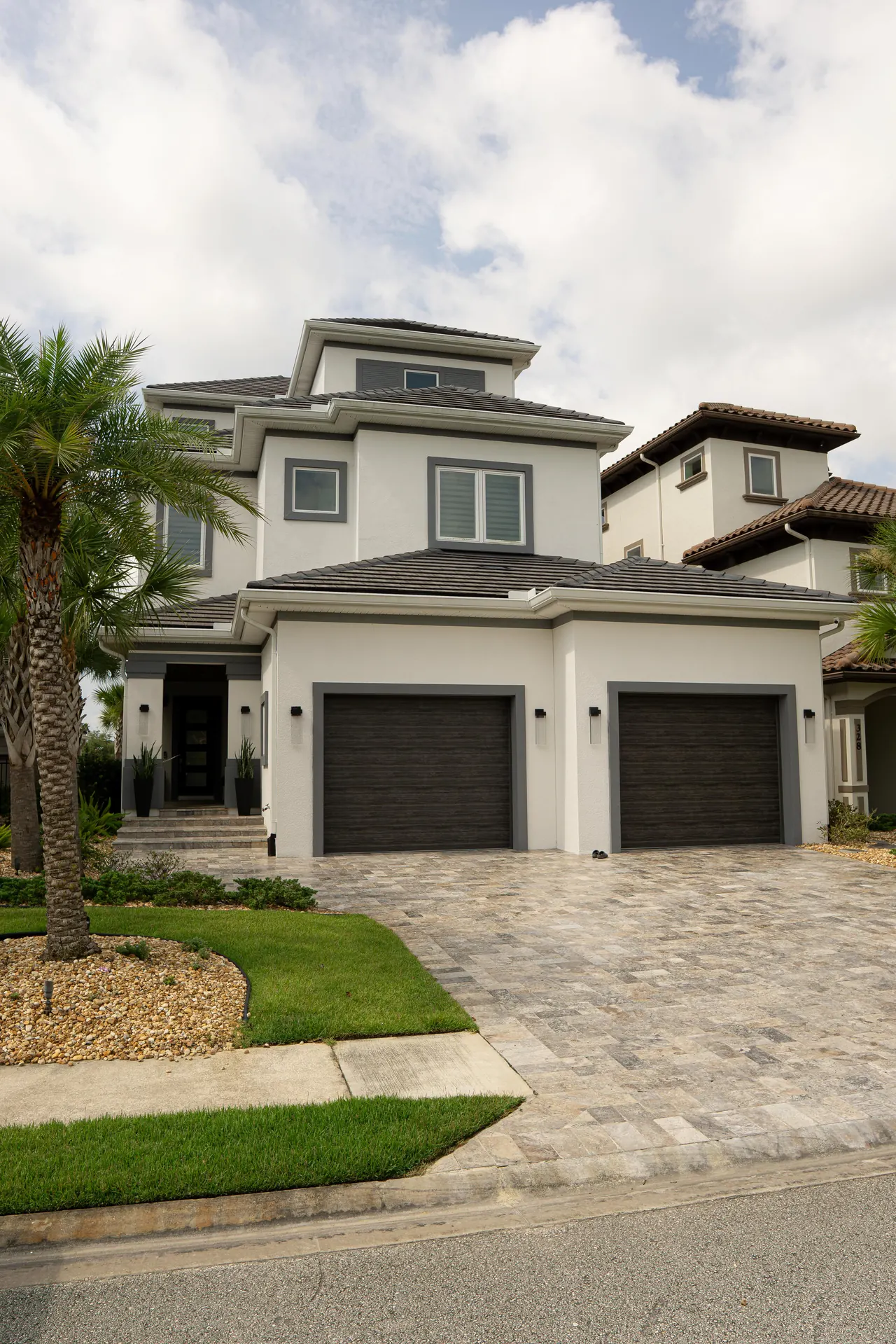 Modern coastal custom home with warm stone details