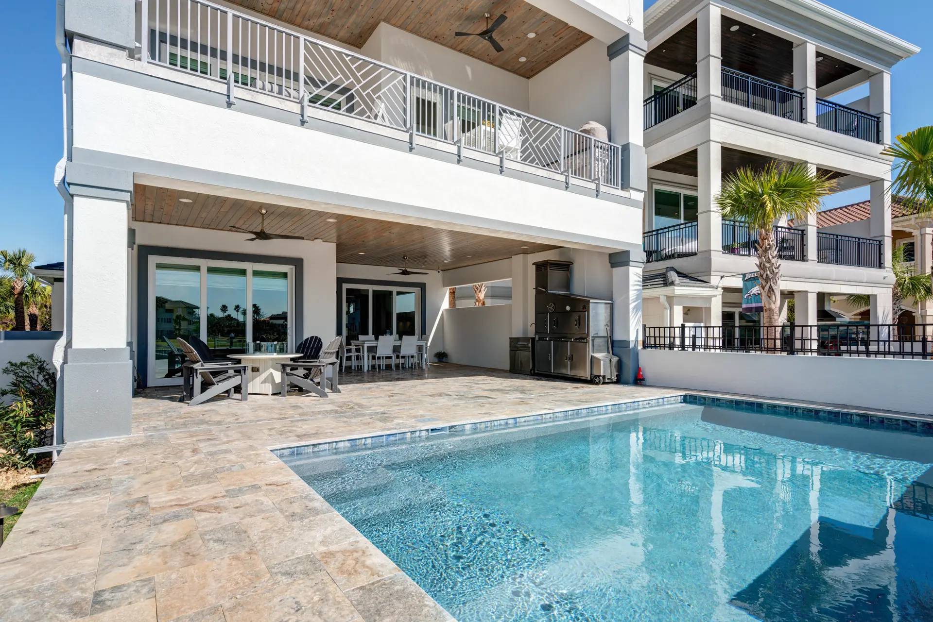 Private pool terrace at a waterfront custom home