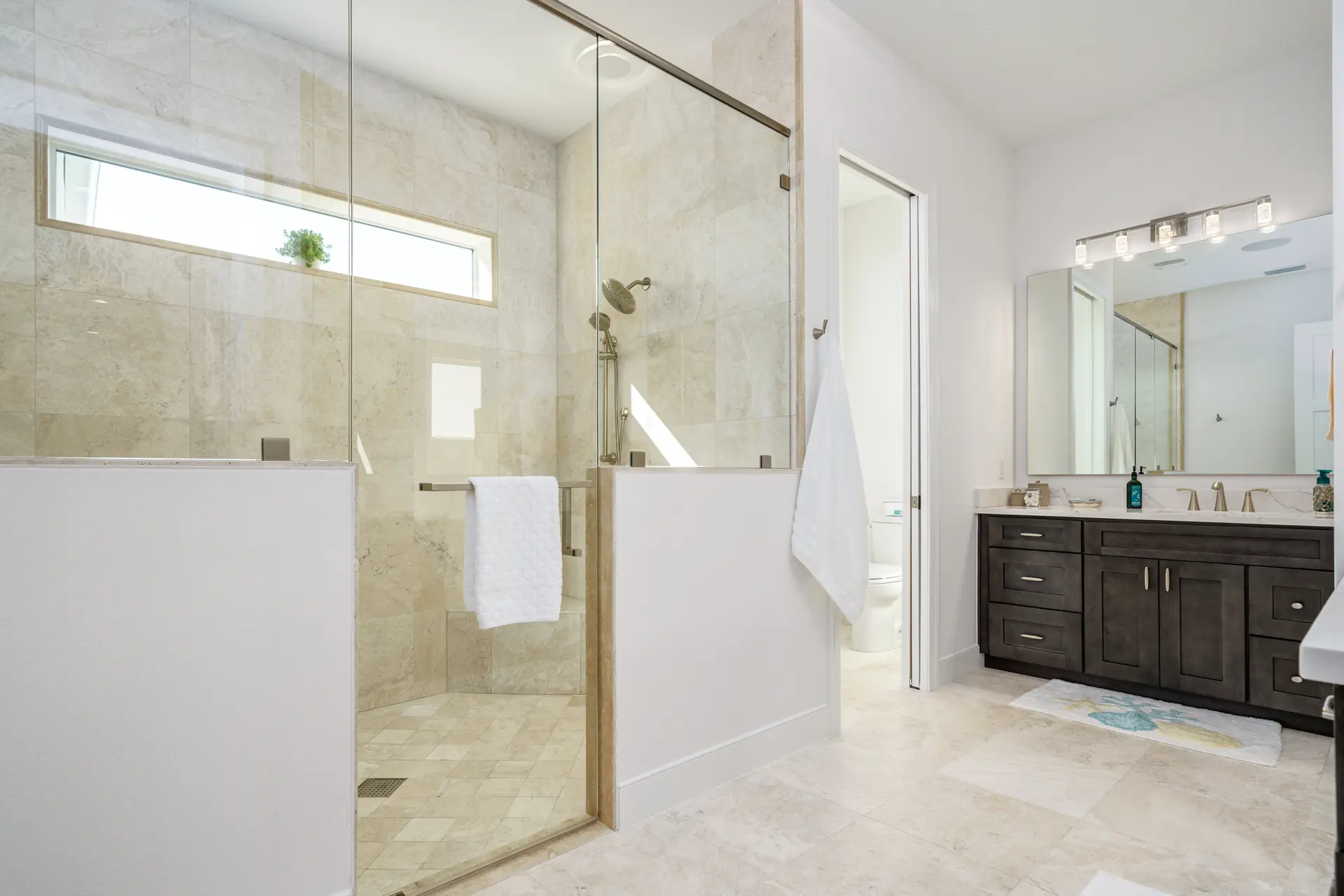 Primary bathroom with freestanding tub and glass shower