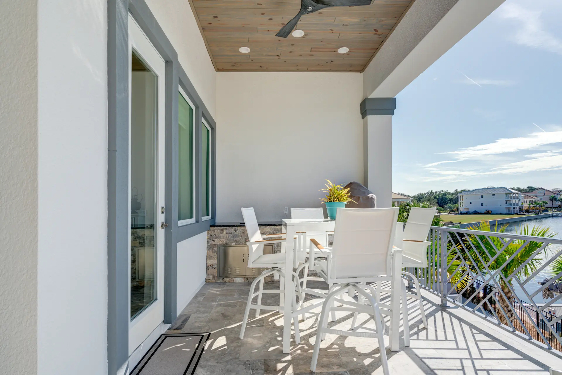 Waterfront balcony with a dining area and panoramic views