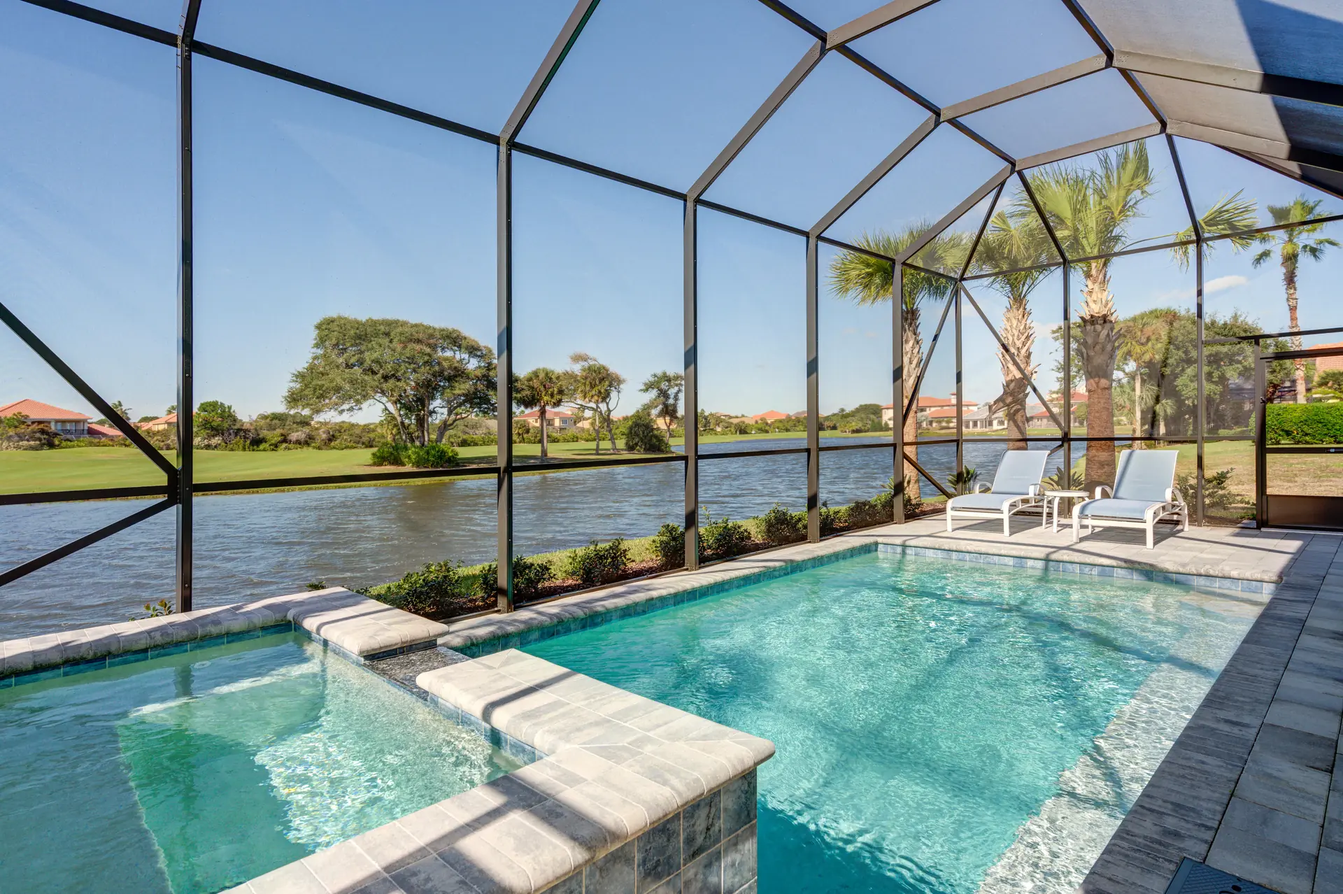 Screened pool overlooking the water and golf course