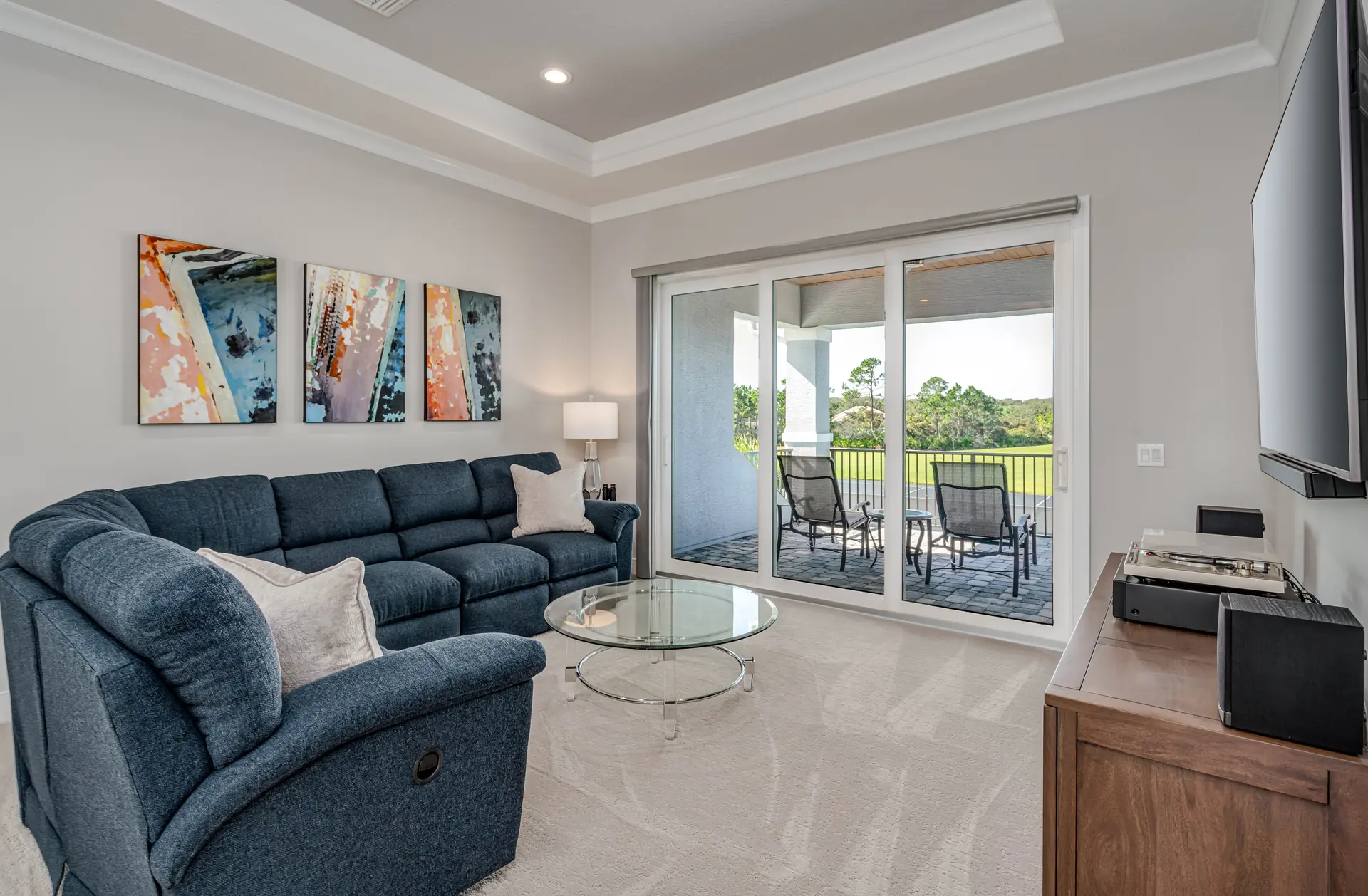 Relaxed sitting room with lake views and covered patio access